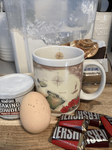 Cup, eggs, baking powder, and chocolate