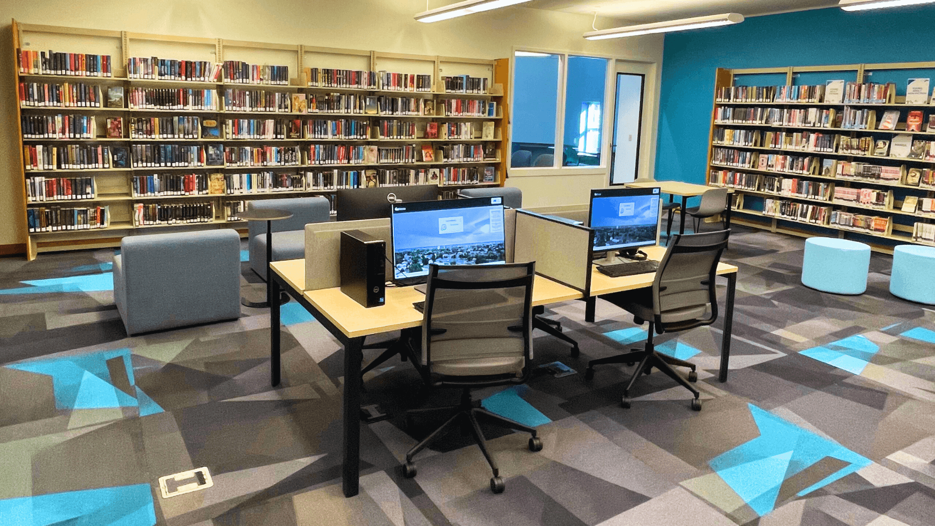 Computers and books in a library