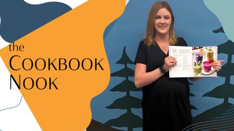 Woman holding cookbook