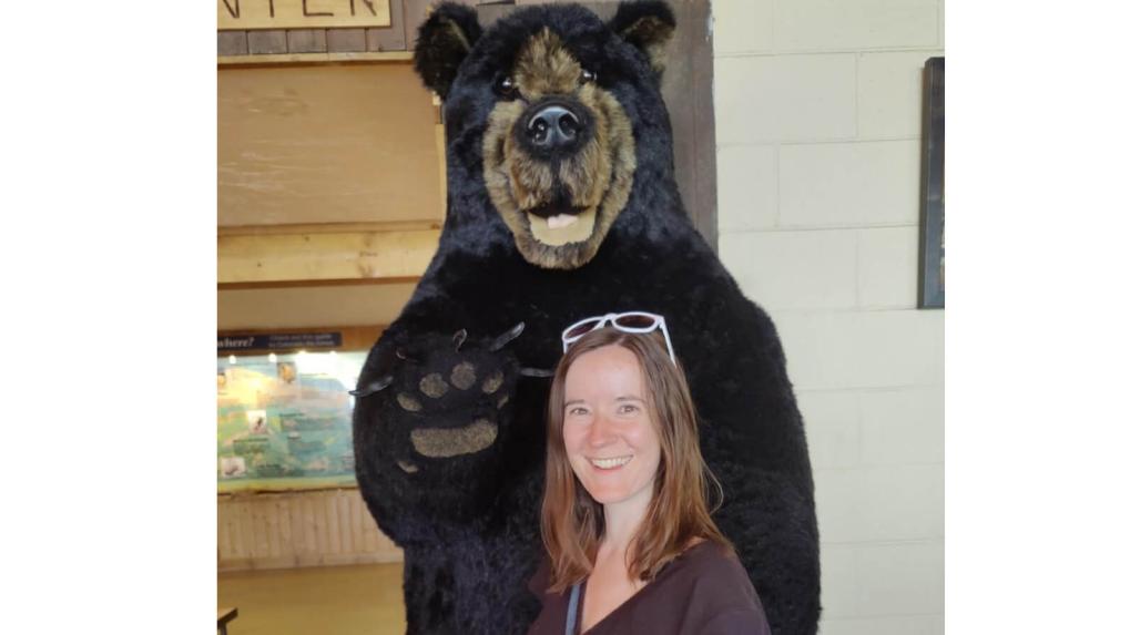 Woman and Stuffed bear statue