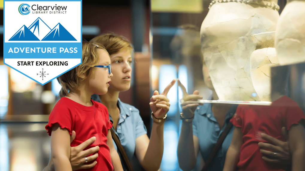 Mom and child looking at museum exhibit