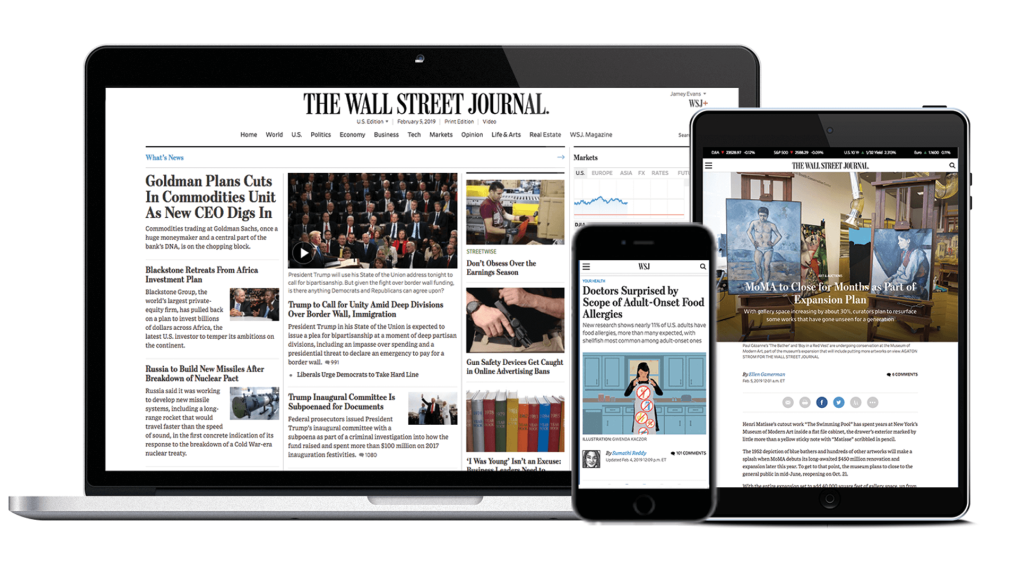 Laptop phone and tablet with the Wall Street Journal