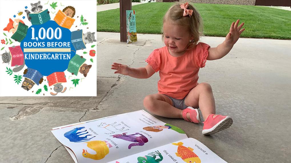 1000 Books Before Kindergarten child reading outside