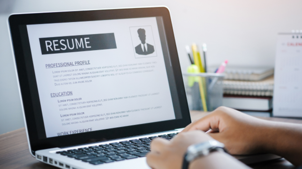 Person with resume on their laptop